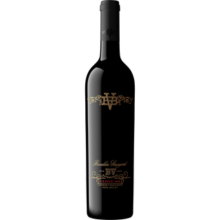 Black wine bottle with gold label on a white background